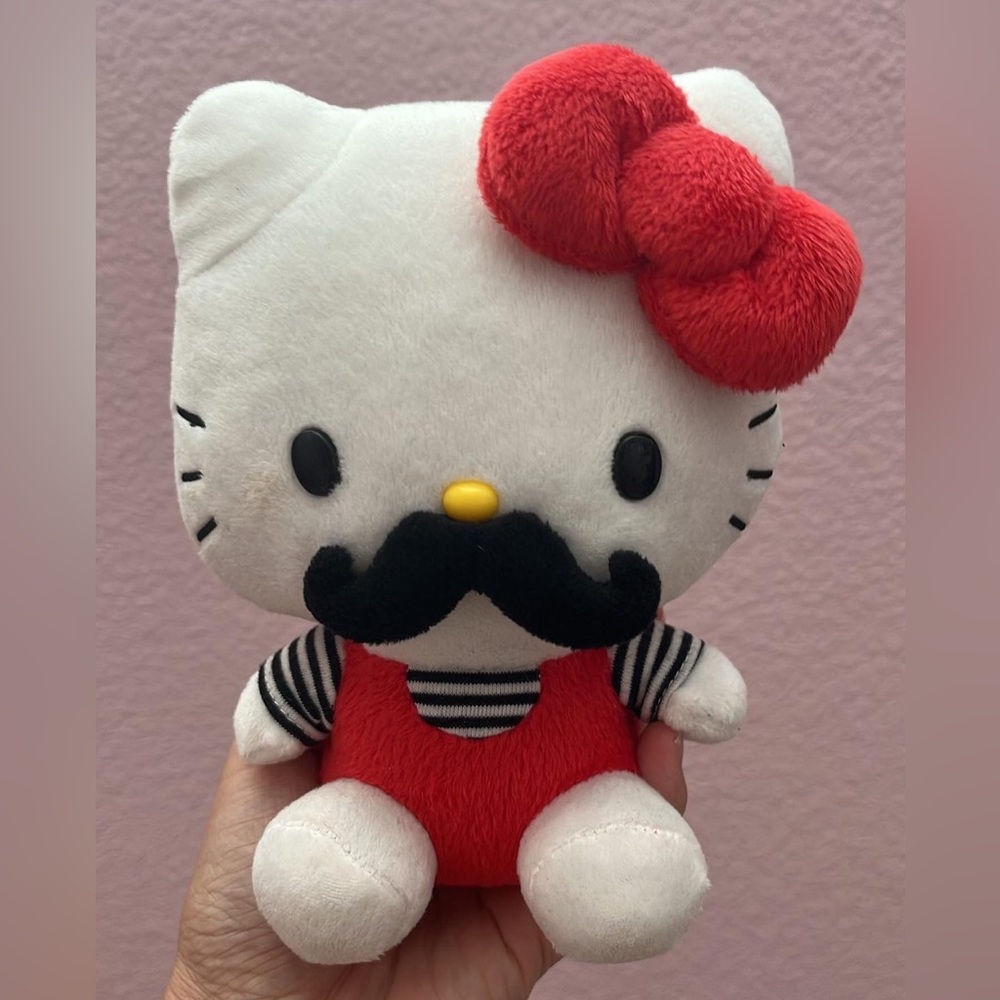 Hello kitty mustache plushie. Sanrio tag attached in great condition.